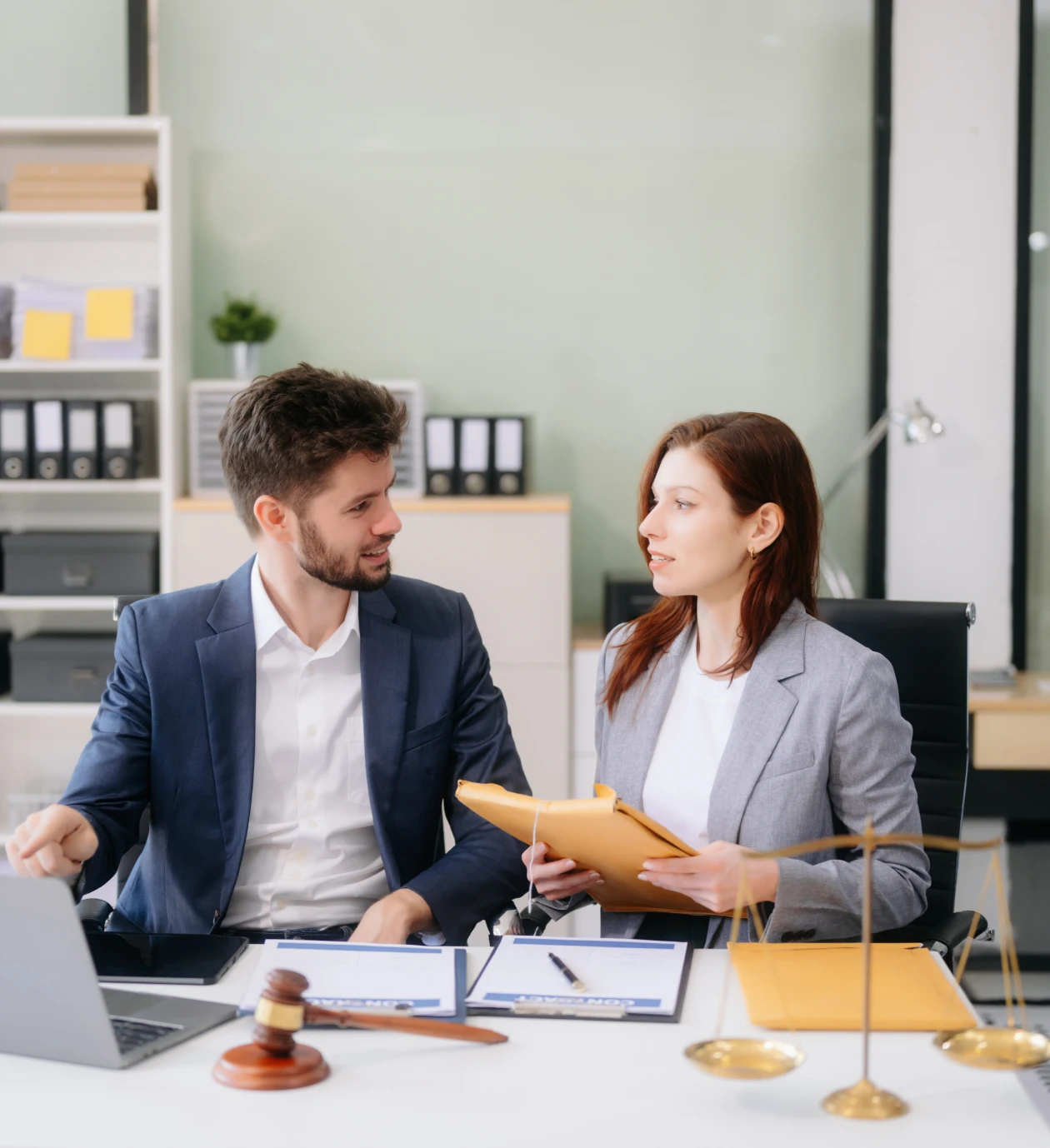 Business meeting with documents and laptop